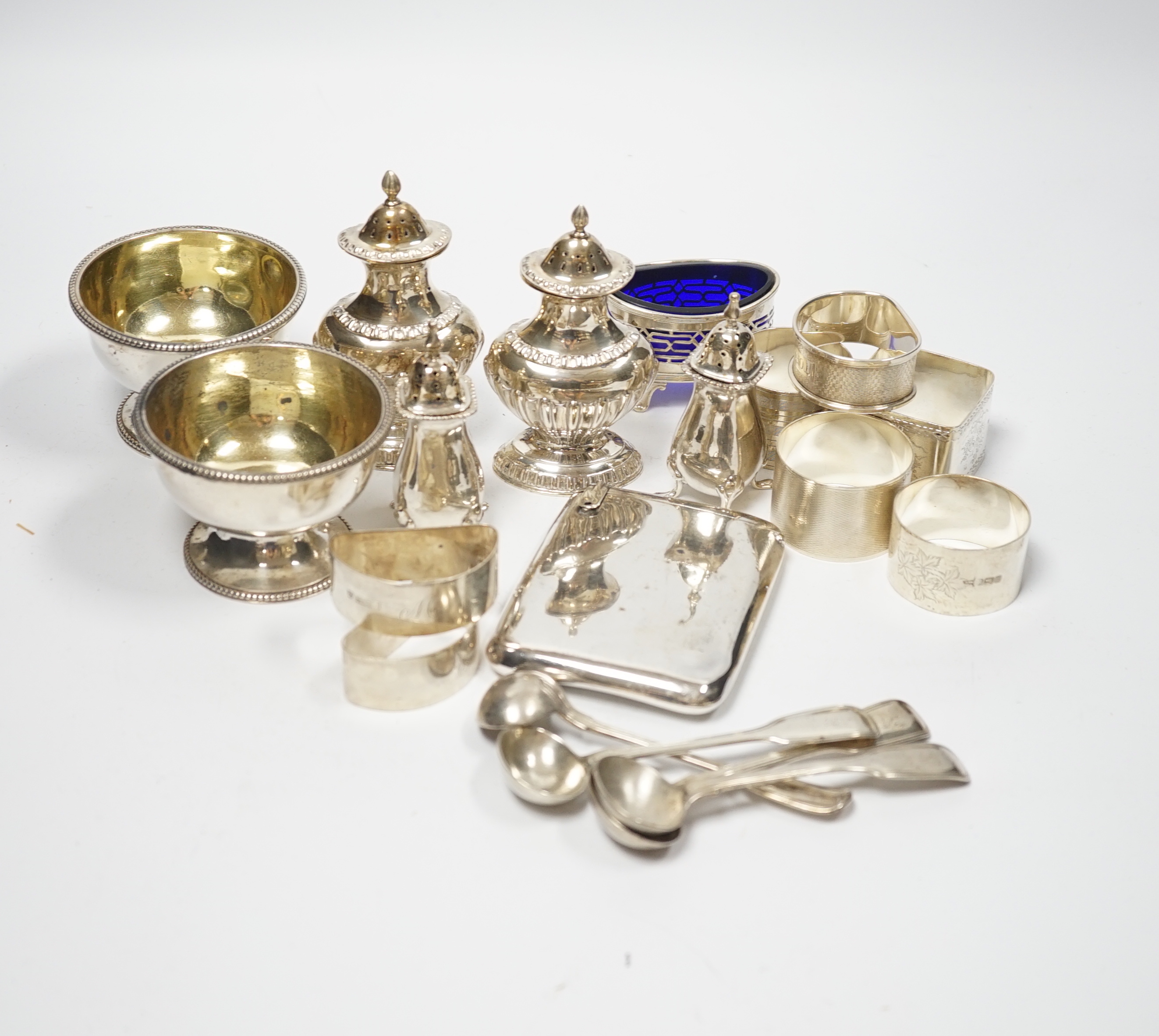 Sundry small silver including a pair of Victorian salts, condiments, napkin rings and an unusual flask?